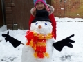 Jaide Staples (4) with her snowman in Spalding.