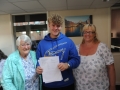 Bailey Raven received a nine an eight and five sevens. He's pictured with mum Sally and nan Pat Savory