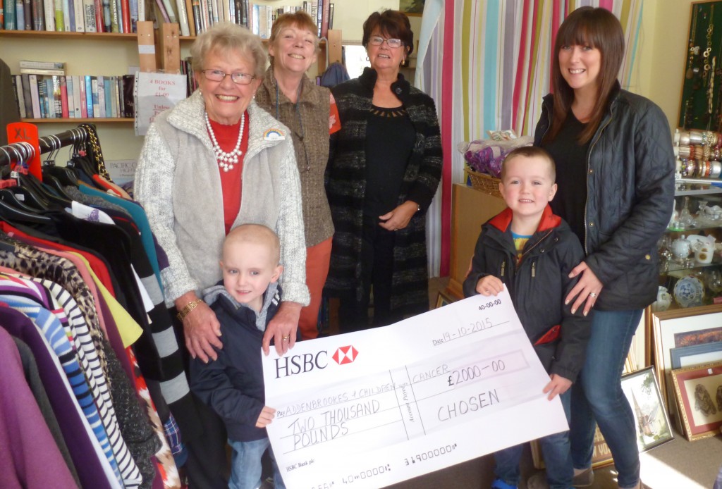 With Lucas, Ethan and mum Joanne Devaney are staff at Chosen charity shop in Holbeach, which donated £2,000 to the cause. Photo supplied.