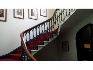 One of the rather grand staircases with artwork adorning the walls. 