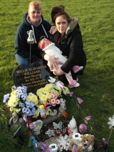 At the grave of stillborn Millie Williams are mum Becci Holden, with daughter Amber, and grandmother Joy Holden.