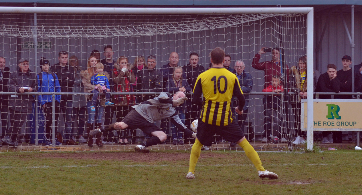 KEY MISS: Holbeach’s Jake Clitheroe sees his penalty saved by Luke McShane. Photo by JAKE WHITELEY