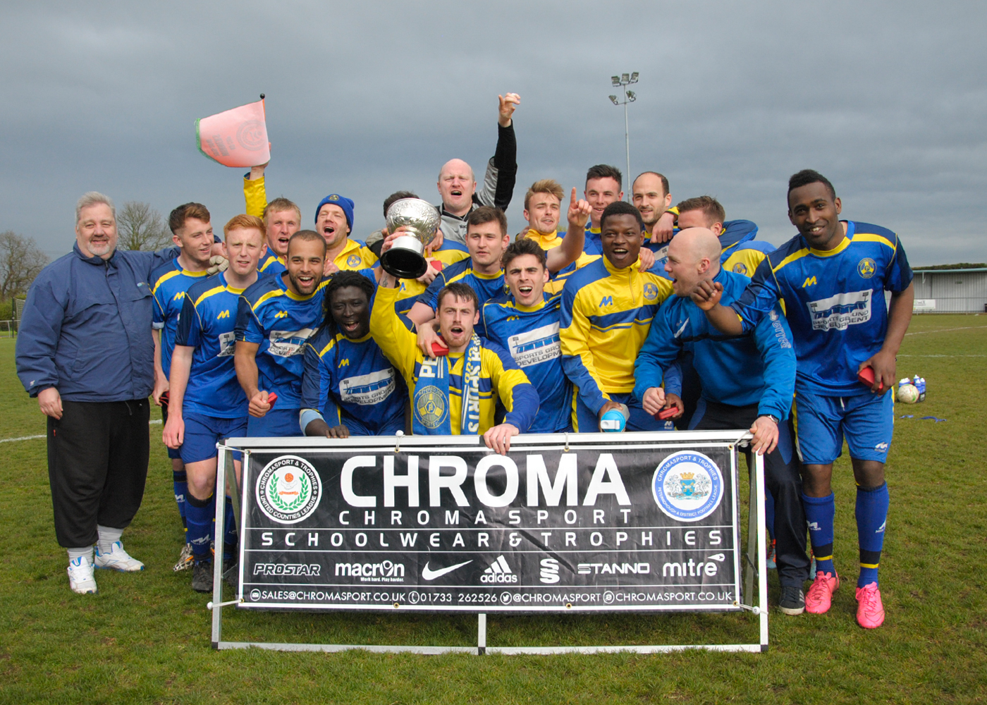 WINNERS: Peterborough Sports celebrate with their trophy. Photo by JAKE WHITELEY