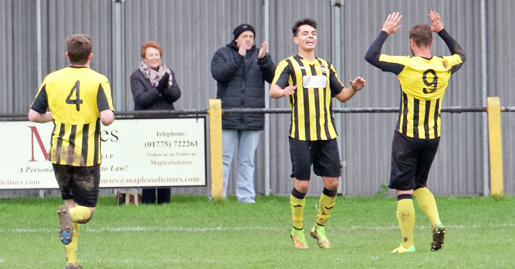 SIGNING: Jenk Acar (centre) has joined Spalding United on loan. He is pictured playing for Holbeach United last season. Photo by STEVE RELF