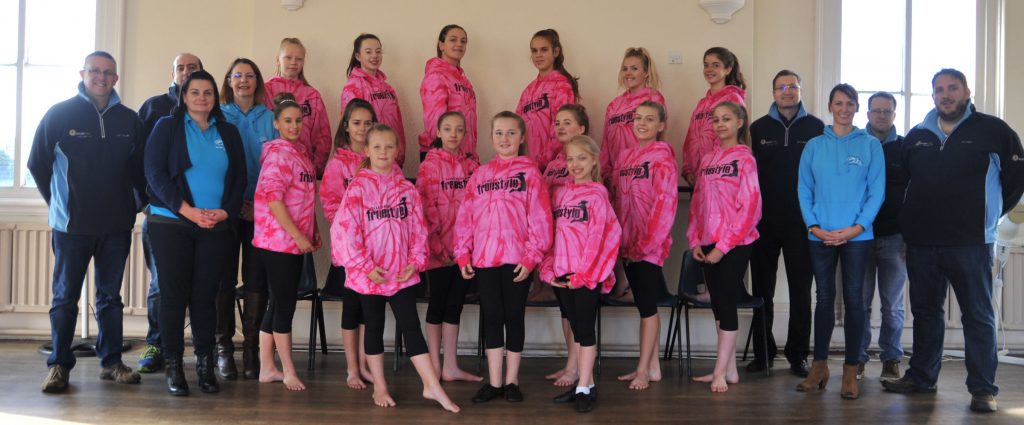 Spalding dance group Diamondz DG in their sponsored hoodies, with members of Spalding Ladies' Circle and Spalding Round Table.