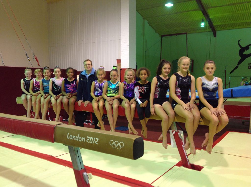 Spalding Gymnastic Academy got a contribution towards mats for its London Olympics 2012 beam. Members are pictured with Spalding and District Round Table chairman Matt Burchnall.