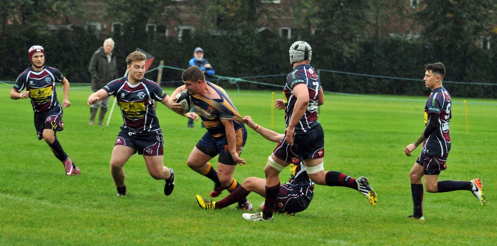 STRENGTH IN NUMBERS: A host of Town players chase down an opponent on Saturday. Photo by ADRIAN SMITH