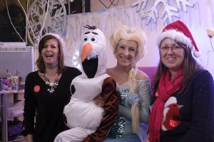 Holobeach Hub Christmas Celebration organisers Tracey Carter (left) and Kay Piccaver (right) with PartyAngelz’ Frozen characters Elsa (Zoe Sheldon) and Olaf (Jade Sheldon-Morris).